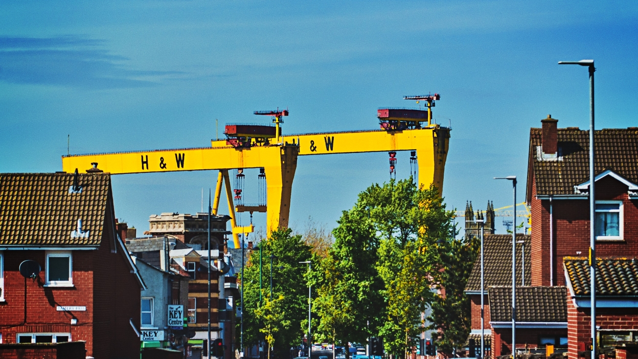 A view of the yellow Harland and Wolff cranes, Samson and Goliath, from East Belfast, with some trees in the foreground